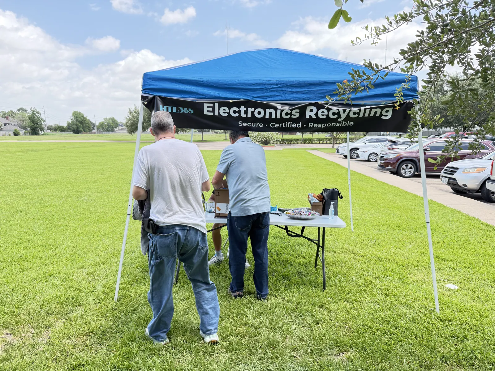 Community members dropping off electronics at the HTL 365 recycling tent at Resurgence Church in Missouri City