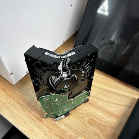 Crushed hard drive bent 90 degrees after secure data destruction at HTL 365 Houston TX